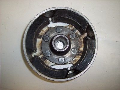 THIS IS AN ENGINE FLYWHEEL OFF OF A 1977 YAMAHA IT175 MOTORCYCLE. THE